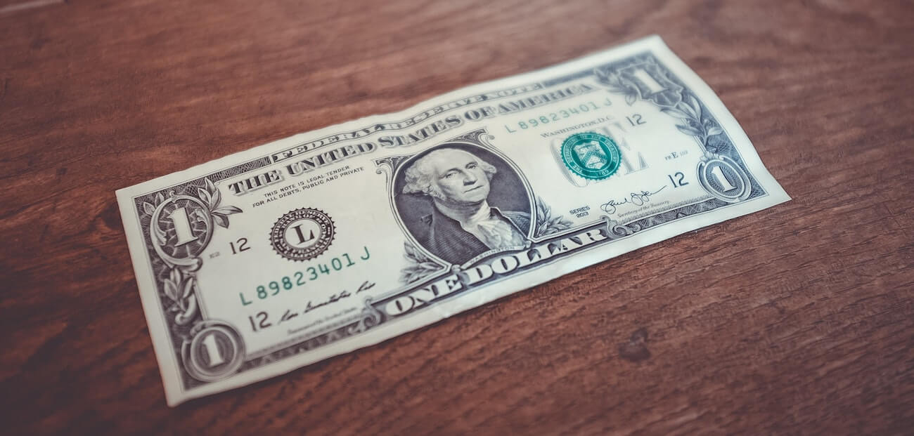 dollar bill on table.